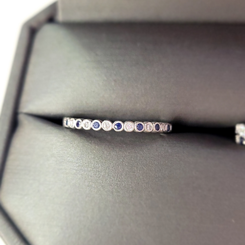White gold ring with blue sapphire and diamonds